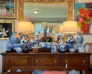 Decorating with blue and white will bring timeless charm to your spaces. Shop a great selection of blue and white porcelain lamps, ginger jars, vases, pots, bowls, and accessories. Shown here on a vintage three drawer vintage Kittinger mahogany sideboard. 