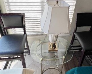 Folding counter/bar stools. Lamp on glass top metal stand. 