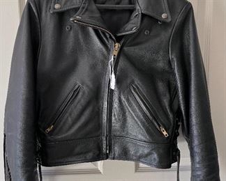 Ladies leather riding jacket...hardly, if ever, worn. Quality leather...says size 12 but might be smaller. Very cool. Check out the fringed back in next photo