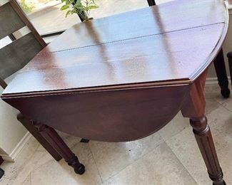 Professionally refinished antique drop leaf table. Perfect for breakfast nook.