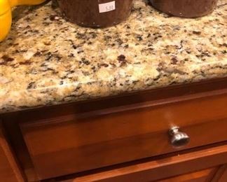 All the granite-topped kitchen cabinets are for sale