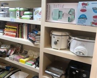 Pantry full of small appliances and kitchenware