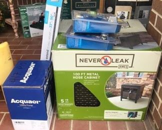 Metal hose cabinet in box and an Acquaer utility pump