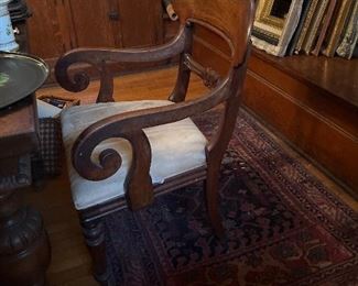 One of six 19 th century chairs, this one has arms …. very sturdy… will last a couple hundred more years