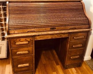 Antique Angus London oak rolltop desk - 48”L, 26”D, 44.5”H. Writing surface is 31”H, opening for chair is 20”W, 25”H.