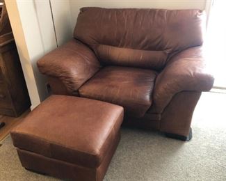 Oversized brown leather chair & ottoman - has some stains (chair 58”L, 39”D, 37”H - ottoman 26”L, 20”D, 16”H