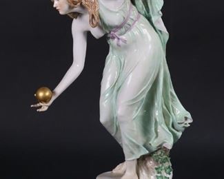17	Meissen Porcelain Figure The Boules Player	Walter Schott for Meissen, German porcelain figurine of a woman, Boule Player. Blue crossed swords mark to the underside. 11 3/4"H. Ball re-glued, flakes to gilt decoration on base, chip to leaf on base.
