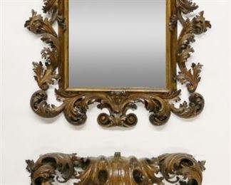 28	Italian Baroque Walnut Mirror and Console	"Italian Baroque walnut and fruitwood ornately carved mirror and console. Mirror 17th century, last 19th century console with 17th century elements. Console was originally topped with marble which is no longer present. Scratches, nicks, scuffs, and abrasions throughout wood of both console and mirror. Losses and portions of carving missing from both mirror and console. Carvings are incredibly delicate.

Mirror: 48"" W x 10 1/2"" D x 61 1/4"" H. Console: 46 3/4"" W x 11 1/4"" D x 34 1/2"" H.

Provenance: Sotheby's European Decorative Arts, Lot 308, October 18th, 2016. From the collection of a prominent Connecticut family."
