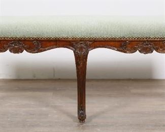 36	Louis XV Provincial Window Bench	"Louis XV Provincial window bench. French, 19th century.  Six carved cabriole legs, stretcher with foliate motifs, later green upholstery. Cushioning on underside has been relined. Small separations to joinery of center legs and apron. Staining to wood on carved motif on one side of bench. Chips, losses, scratches, nicks, and wear to wood throughout carvings, legs, feet, and apron. Small spot stain to upholstery.

47 3/4"" W x 14 3/8"" D x 18 1/2"" H.

From the collection of a prominent Connecticut family."
