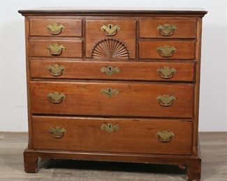 32	Queen Anne Mahogany Chest of Drawers	"Queen Anne chest of drawers. American, 18th century. Mahogany primary wood, pine secondary wood, 8 drawers, center with carved fan motif. Lock plate missing from second lowest drawer. Losses to wood on upper right corner of lowest drawer front and on upper left of top left drawer front. Wear, scratches, chips, and scuffs to wood throughout top of chest. Scratches and marks to wood on left and right sides of chest. Chips, nicks and losses to wood on bracket feet and throughout edges of apron.

41 1/4"" W x 20 5/8"" D x 38 1/8"" H

From the collection of a prominent Connecticut family."
