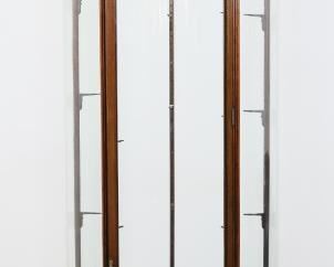 40	19th Century English Rounded Vitrine	"English rounded vitrine or curio cabinet. 19th century. Walnut frame, urn final, three glass shelves. Original key is included. Brass ring door pulls stamped ""PATENT 3558 E. POLLARD & CO. LONDON."" Chips to glass on edges of two shelves. Scratches and scuffs throughout glass shelves. Splits to wood on joinery of legs to apron of vitrine. Nicks and chips to wood on feet of vitrine. From the collection of a prominent Connecticut family.
87"" H x 29 1/2"" diameter"
