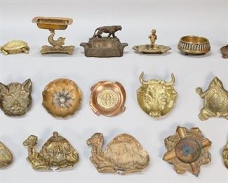 46	Lot of Vintage Ashtrays Brass, Bronze & Copper	Lot of 17 vintage ashtrays, including L. Barth & Sons art deco bronze, 4 brass camels - 1 Tamar, brass cat, brass frog, brass bull, art deco ashtray with lioness, brass ashtray with boy, copper and brass W. Atlee Burpee & Co. "seeds that grow", McClelland Barclay flower, shell casing ashtray, M. Loewenstein ashtray with match holder, brass dolphin form, brass covered frog, brass covered turtle. Shell ashtray 1 7/8" x 3 1/2"-diameter at top, Loewenstein 4 1/9"H.
