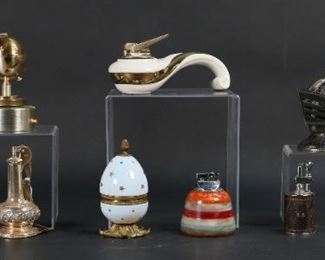 47	9 Vintage Table Lighters Including Ronson	9 vintage table lighters including egg, knight's helmet, musical globe, Ronson marble, Ronson Fantasy, Hatsvi, Ronson Decenter, Ronson Crown, The Executive. Knight 4 7/8"H, Ronson Decanter 4 1/2"H. All untested.
