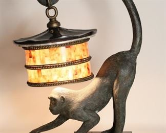 76	Maitland-Smith Bronze Monkey Lamp	Maitland- Smith (20th Century). Bronze monkey lamp with pin shell shade. marked with tag on bottom. Cracks to top of shade. Monkeys hand, rear and tail have small area of damage. Lamp is in working condition. 24" Tall. From the collection of a prominent Connecticut family.

