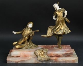 78	Rene Paul Marquet Gilt Bronze Dancer & Musician	Rene Paul Marquet (France, 1875-1939). Gilt bronze group dancer and musician. On a pink marble base. Signed on the base Marquet, and numbered on the base 6025. 15 5/8"L x 8"D x 3/4"W x 12 7/8"H. Chips to corners and edges of marble base; musician with lines to face, missing one string on mandolin, missing one hand and missing two fingers on remaining hand; dancer lines to face and arms, missing fingers on one hand.
