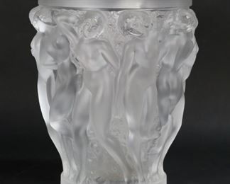 75	Lalique Bacchantes Molded Glass Vase	Lalique molded and frosted glass vase with dancing nudes, Bacchantes. Signed on the underside Lalique France. 9 3/4"H x 7 3/8"-diameter at top. Scratches to underside.

