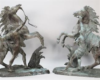 80	Pair Bronze Marly Horses After Guillaume Coustou	After Guillaume Coustou the Elder (French, 1677-1746). Pair of patinated bronze Marly horse sculptures after the original marble statues commissioned by Louis XV for the Chateau de Marly. Each signed on the base Coustou. 21"L x 23"H. Some oxidation and discoloration, white spots present on both, 2 small cracks to the base of one. From the collection of a prominent Connecticut family.
