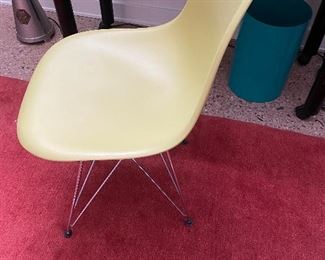 Yellow Eames plastic chair