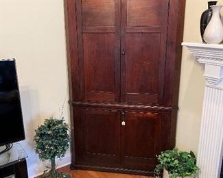 Large antique early corner cabinet in walnut