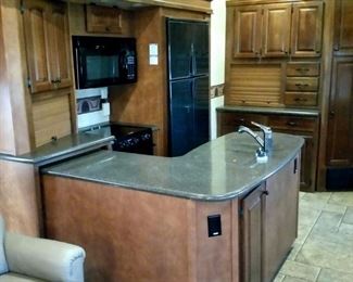 The kitchen has solid surface countertops.