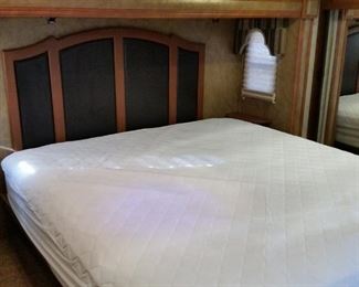 The bedroom has a king-size bed