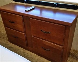 Dresser near the foot of the bed