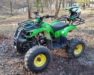 Taotao 125cc quad ATV with matching helmet.  Has remote start and start lockout.