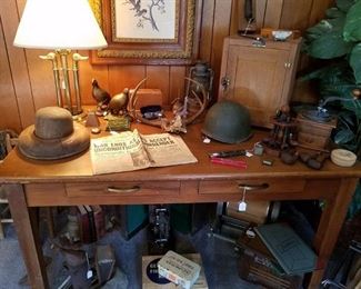 Vintage table filled with vintage and antique items