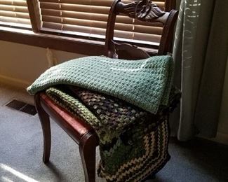 Carved mahogany chair and several more locally made afghans
