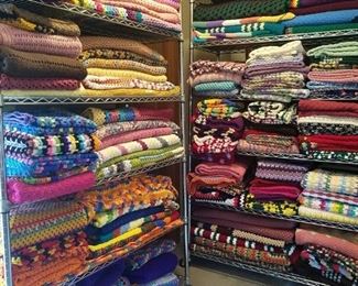 Large assortment of new handmade afghans
