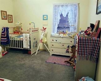 This bedroom features a mid-century three-piece nursery set