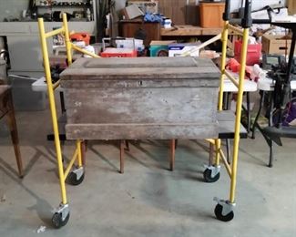 Vintage chest sitting on rolling scaffold