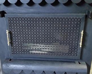 The door can be removed and the screen placed over the opening so the flames can be seen.