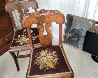 Pair of antique carved wood chairs with needlepoint seats