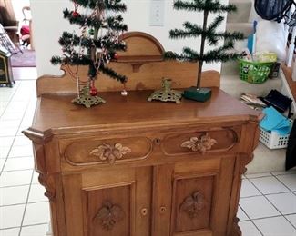 Antique goose feather Christmas trees. Antique sideboard server with acorn pulls