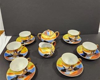 Tea cups & saucers, creamer and sugar