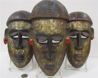 SET OF THREE AFRICAN MASKS WITH STAMPED METAL ACCENTS