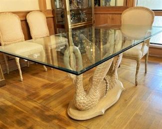 #25- Buccola Dining Table +5 Chairs / Carved wood Swans base w/beveled glass top dining table and 
Five matching chairs / TABLE: 29” T x 72” L x 38” W

