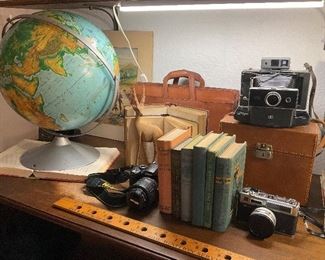 World Globe, vintage books, cameras,  Polaroid 250 Land Camera,  Nikon D60, Yashica Electro 35, 