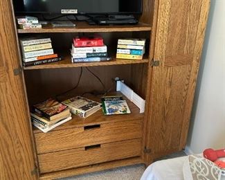 Armoire for TV or clothes.  Has place for rod.