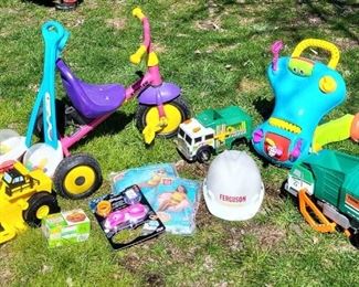 Outdoor Toys for the Kids...Toy Trucks, Swim Tubes, Push Toys, and a Tricycle