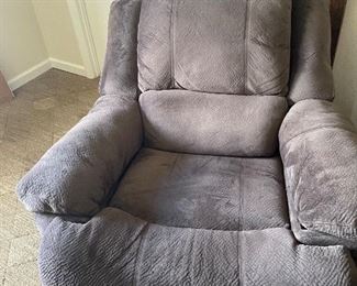 Brown cloth recliner with electrical plug ins. 