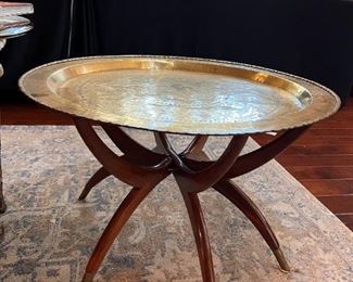 Brass spider legged cocktail table 