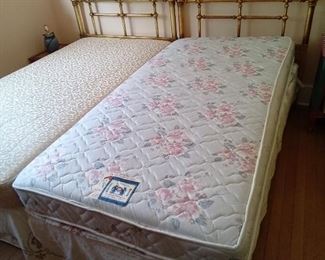 Twin beds with Mattress Boxspring frame and copper tone headboard