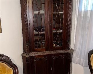 #26 MAHOGANY WOOD VINTAGE CORNER CABINET, Bottom closed doors, shelves inside, Top Glass Doors-Open Grille Design-2 shelves, very good condition $1000.00