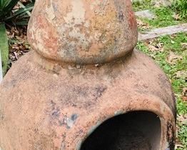 Clay Chiminea with Iron Stand.