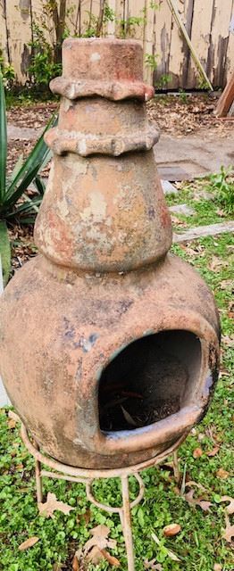Clay Chiminea with Iron Stand.