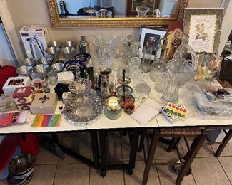 Barware, crystal pitchers and decanters, local art, plate stands