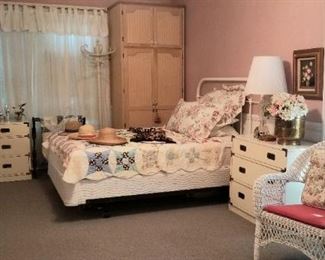 A view into the main Bedroom, with Cast Iron bed and Mid-century dresser, chest and nightstand