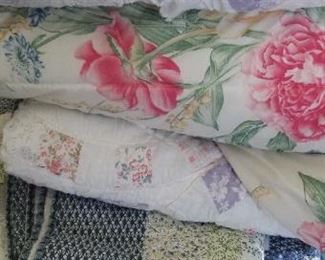 Lots of garden bedding and vintage quilts